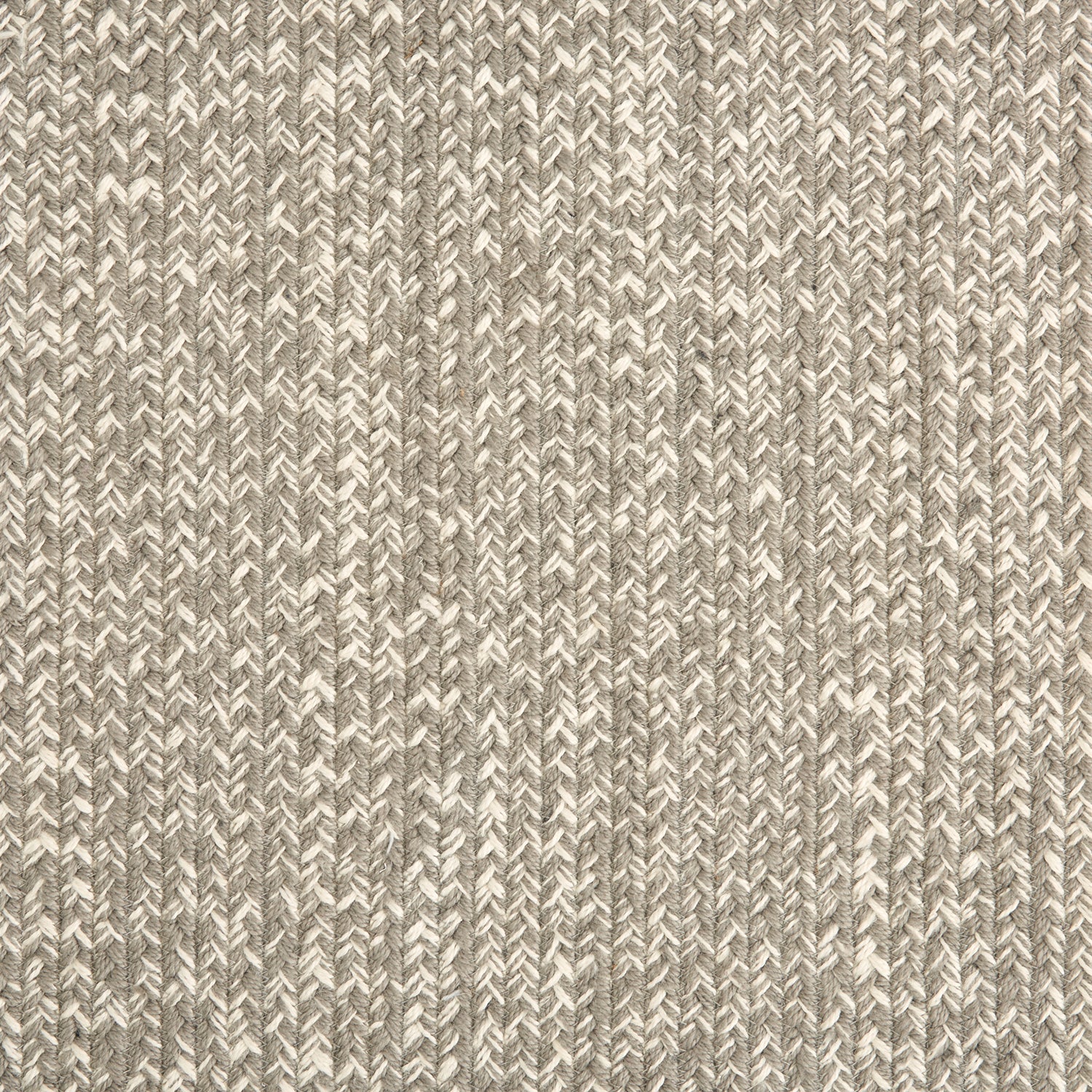 Outdoor broadloom carpet swatch in a chunky ribbed weave in mottled brown and cream.
