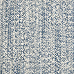 Outdoor broadloom carpet swatch in a chunky ribbed weave in mottled cream and navy.