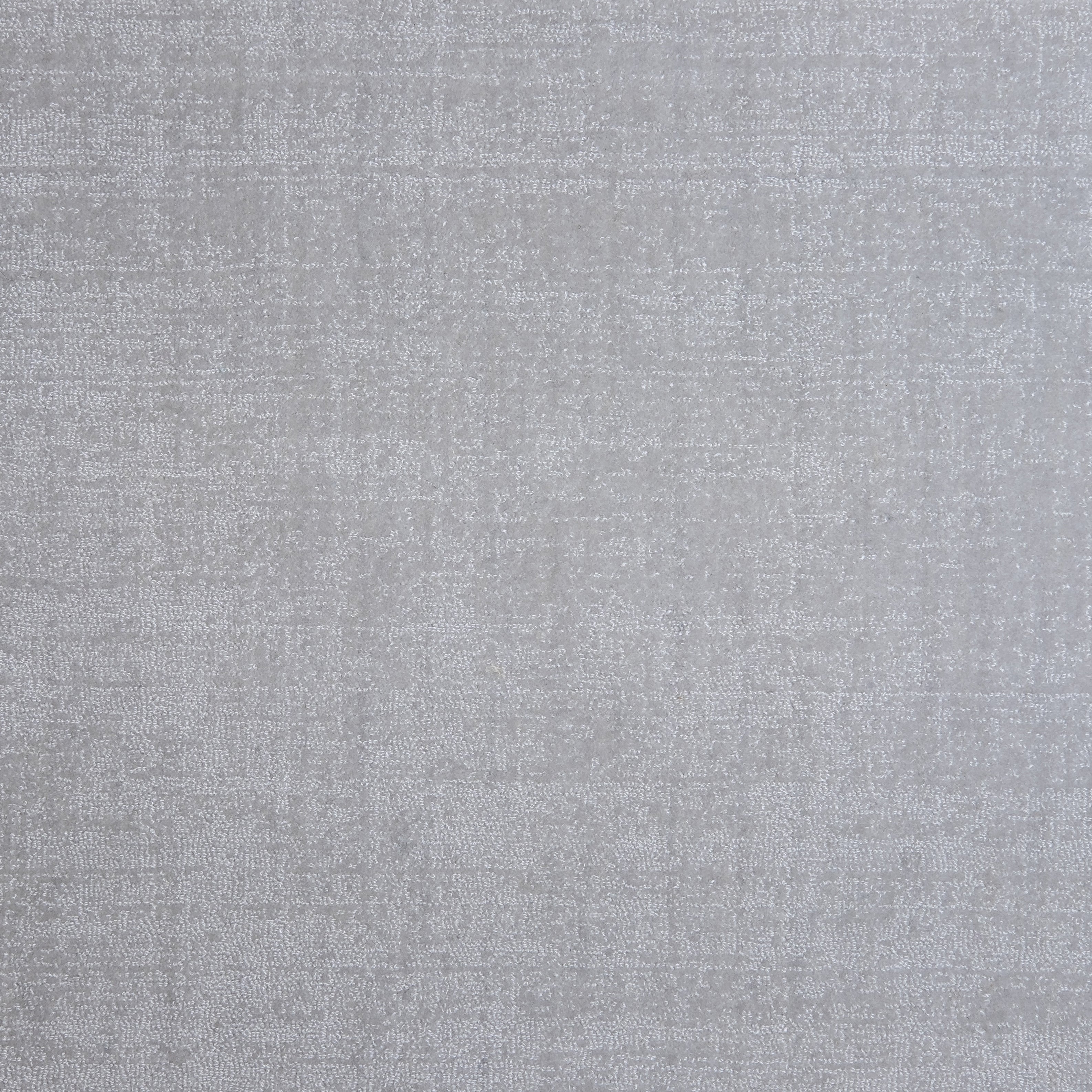 Nylon broadloom carpet swatch in a textured weave in iridescent gray.