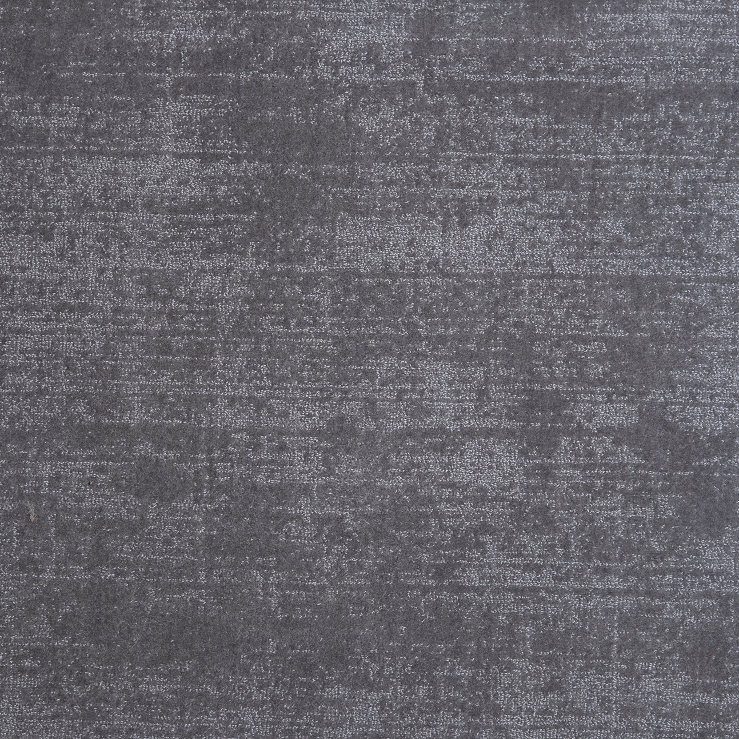 Nylon broadloom carpet swatch in a textured weave in iridescent charcoal.