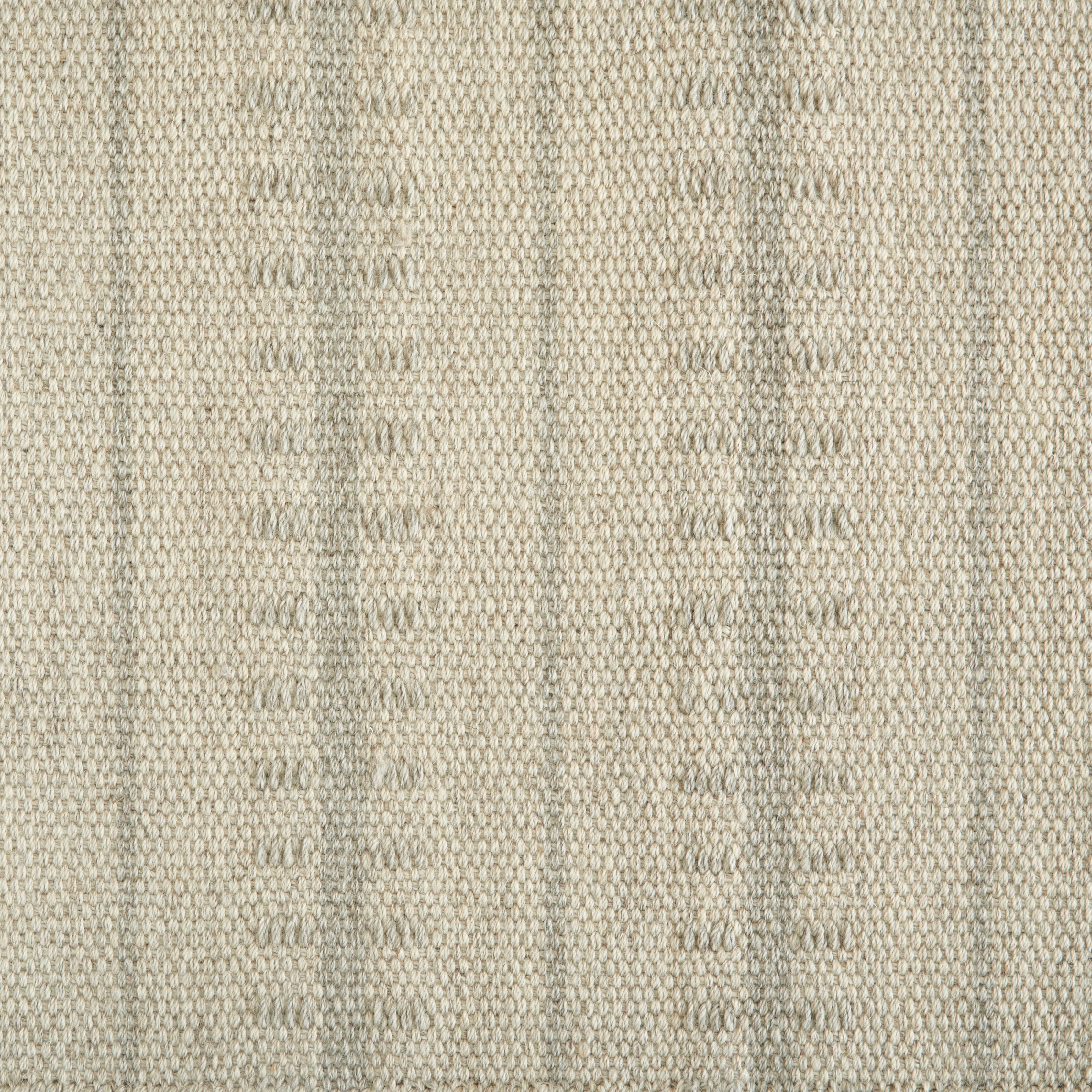 Wool broadloom carpet swatch in a ticked stripe weave in cream and tan.