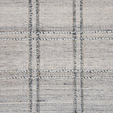 Wool-blend broadloom carpet swatch in a plaid tweed weave in cream and silver.
