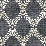 Wool broadloom carpet swatch in a leafy lattice print in white on a charcoal field.