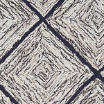 Wool broadloom carpet swatch in a diamond lattice print in cream and gold on a charcoal field.