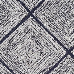Wool broadloom carpet swatch in a diamond lattice print in silver on a charcoal field.