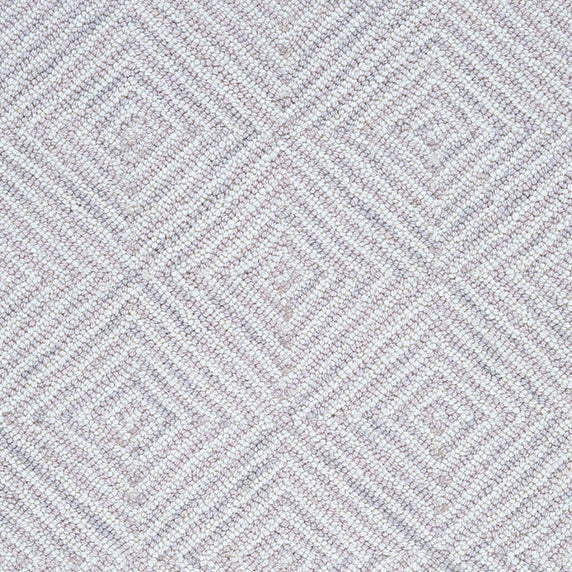Wool broadloom carpet swatch in a dense repeating diamond print in shades of mauve and cream.