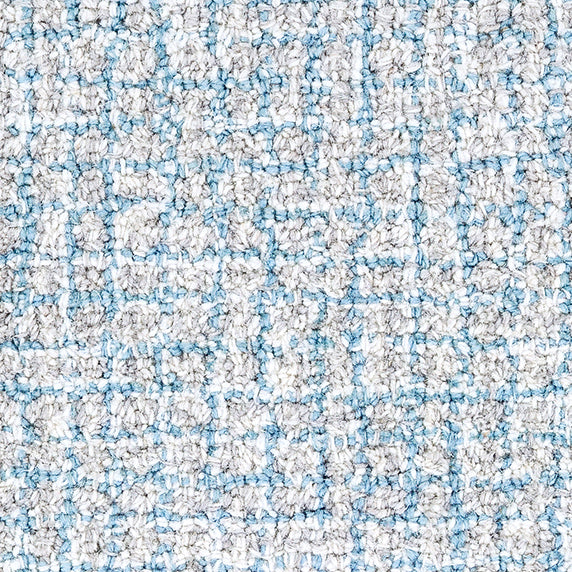 Wool broadloom carpet swatch in a high-pile weave in mottled white, gray and light blue.
