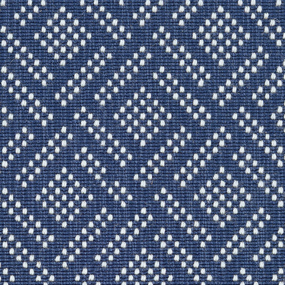 Wool broadloom carpet swatch in a chunky diamond-print weave in white on a navy field.