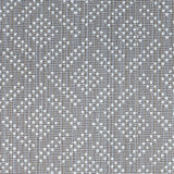 Wool broadloom carpet swatch in a chunky diamond-print weave in white on a gray field.
