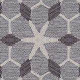 Wool broadloom carpet swatch in a geometric lattice pattern in cream and charcoal on a gray field.