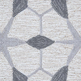 Detail of a wool broadloom carpet swatch in a geometric lattice pattern in shades of grey on a cream field.