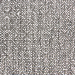 Wool-nylon broadloom carpet swatch in a geometric lattice print in cream and charcoal.