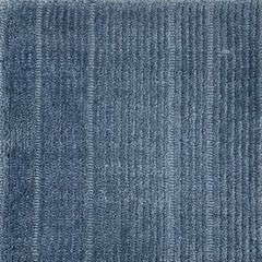 Nylon broadloom carpet swatch in a ribbed weave in blue.