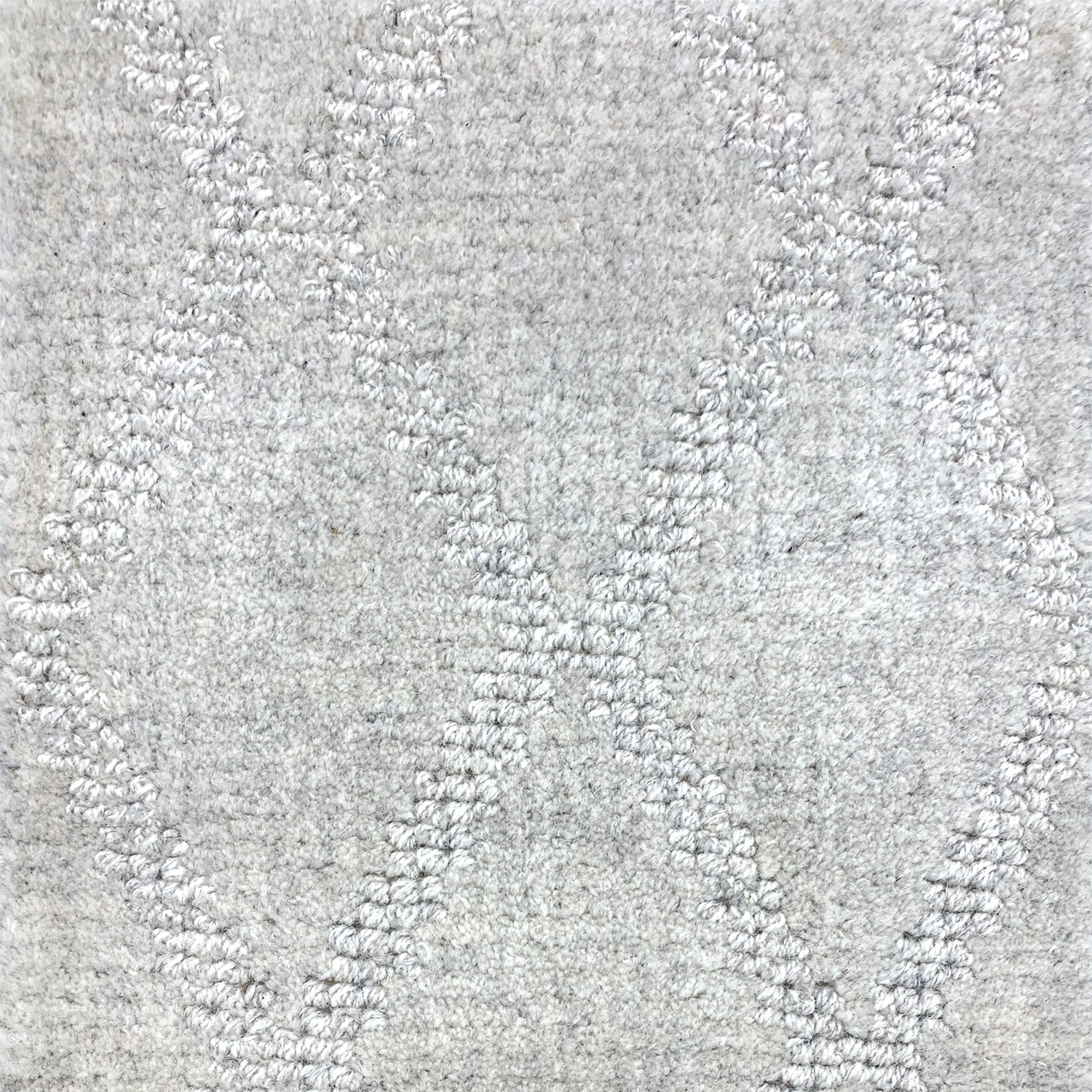 Wool-blend broadloom carpet swatch in a silver diamond lattice print.