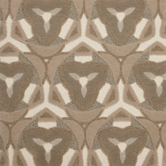 Detail of Gigi Rug featuring a geometric floral motif with a mix of cut pile and linear loops in shades of ecru, tan and ivory