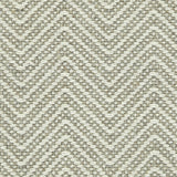 Wool broadloom carpet swatch in a chunky herringbone weave in brown and cream.