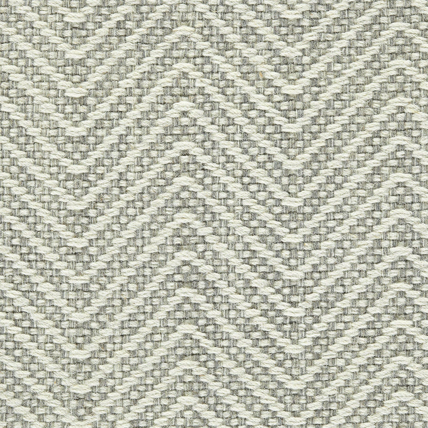 Wool broadloom carpet swatch in a chunky herringbone weave in silver and cream.