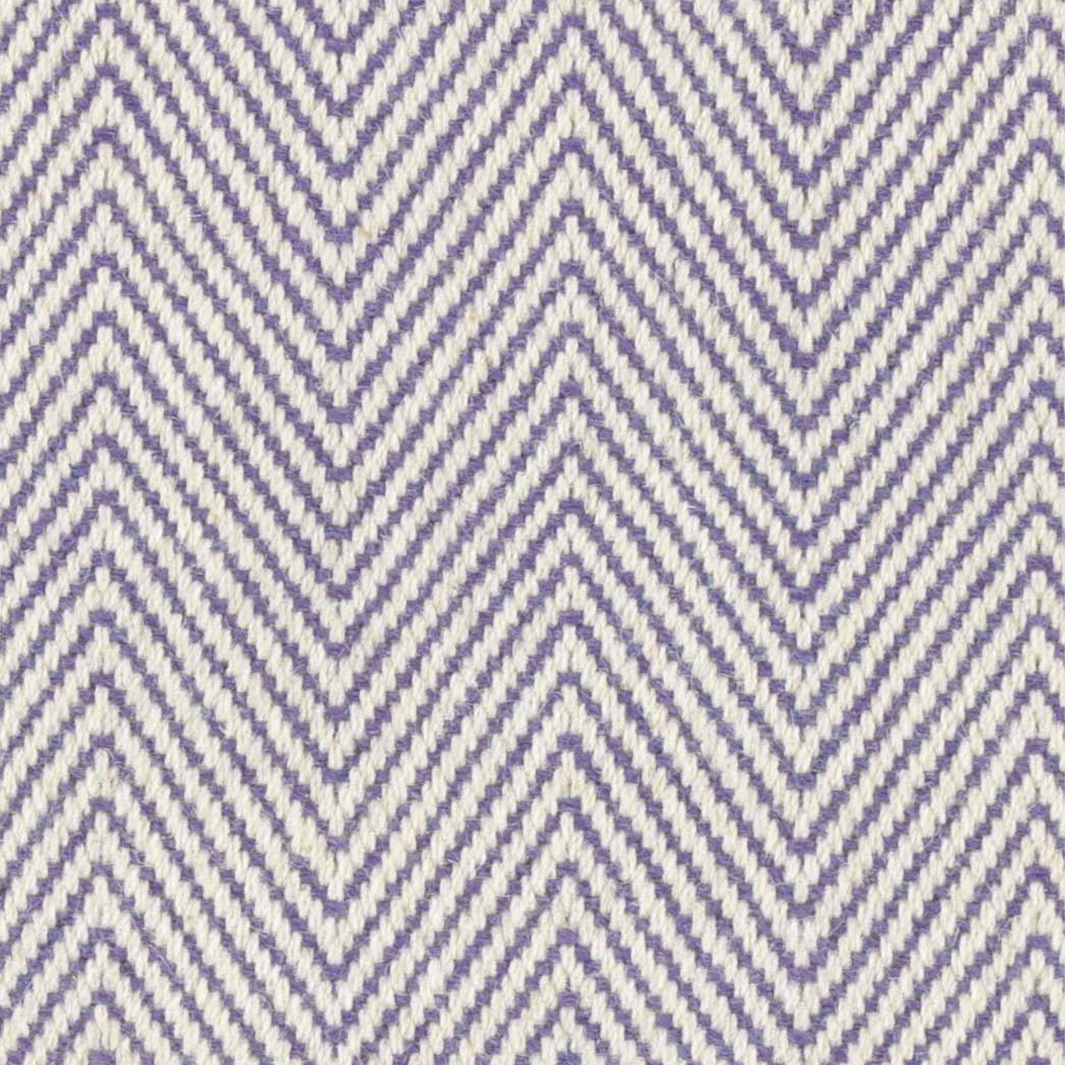 Wool broadloom carpet swatch in a herringbone weave in purple and cream.