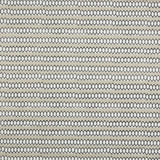 Swatch of fabric with rows of hand-drawn black and white honeycomb shapes on a tan background.