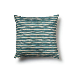 Square throw pillow in a striped pattern of hand-drawn blue and navy honeycomb shapes on a cream background.