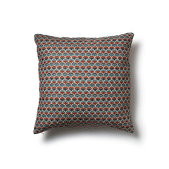Square throw pillow with a repeating Japanese-inspired scalloped pattern in shades of blue, red and cream.