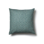 Square throw pillow with a repeating Japanese-inspired scalloped pattern in shades of blue, and cream.