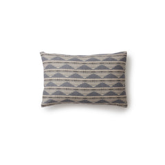 Square throw pillow in a linear pattern with a sand dune-shaped triangle stripe motif in shades of navy, light blue and gray.