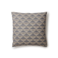 Square throw pillow in a linear pattern with a sand dune-shaped triangle stripe motif in shades of navy, light blue and gray.