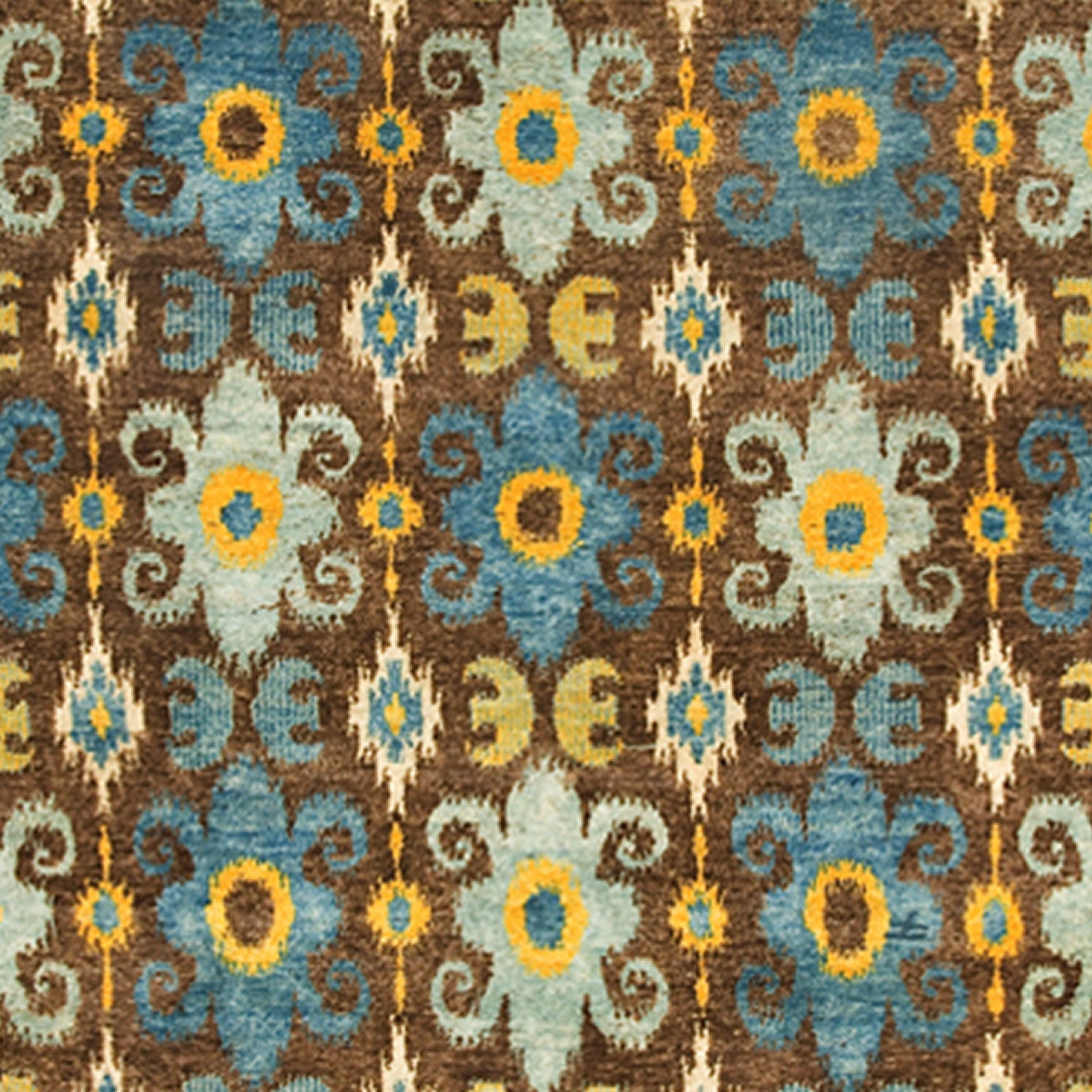 Woven rug swatch in a repeating ikat floral pattern in shades of blue and yellow on a brown field.