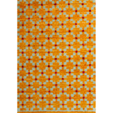 Rectangular rug in a large-scale grid pattern featuring squares of mustard, light blue and red.