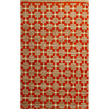Rectangular rug in a large-scale grid pattern featuring squares of red, tan and cream.