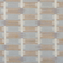 Woven rug swatch in a stripe motif broken by rows of rectangular shapes in white and gray on a blue and tan field.