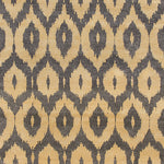Detail of a woven rug with a grey and beige ikat diamond motif.