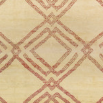 Woven high-pile rug swatch in a large-scale interlocking diamond pattern in red on a cream field.