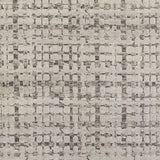 Woven rug swatch in a small-scale honeycomb pattern in dark gray on a gray field.