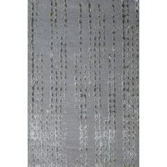 Rectangular rug in gray with a repeating "raindrop" pattern in various shades of gray.