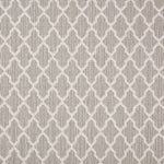 Wool-blend broadloom carpet swatch in a geometric lattice print in cream on a light brown field.