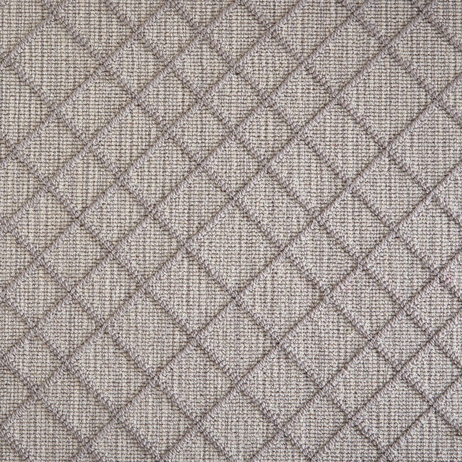 Wool-blend broadloom carpet swatch in a dimensional lattice print in gray on a mottled gray field.