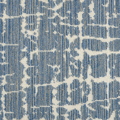 Wool-blend broadloom carpet swatch in an abstract grid pattern in cream on a mottled blue and tan field.