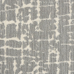 Wool-blend broadloom carpet swatch in an abstract grid pattern in tan on a mottled gray field.