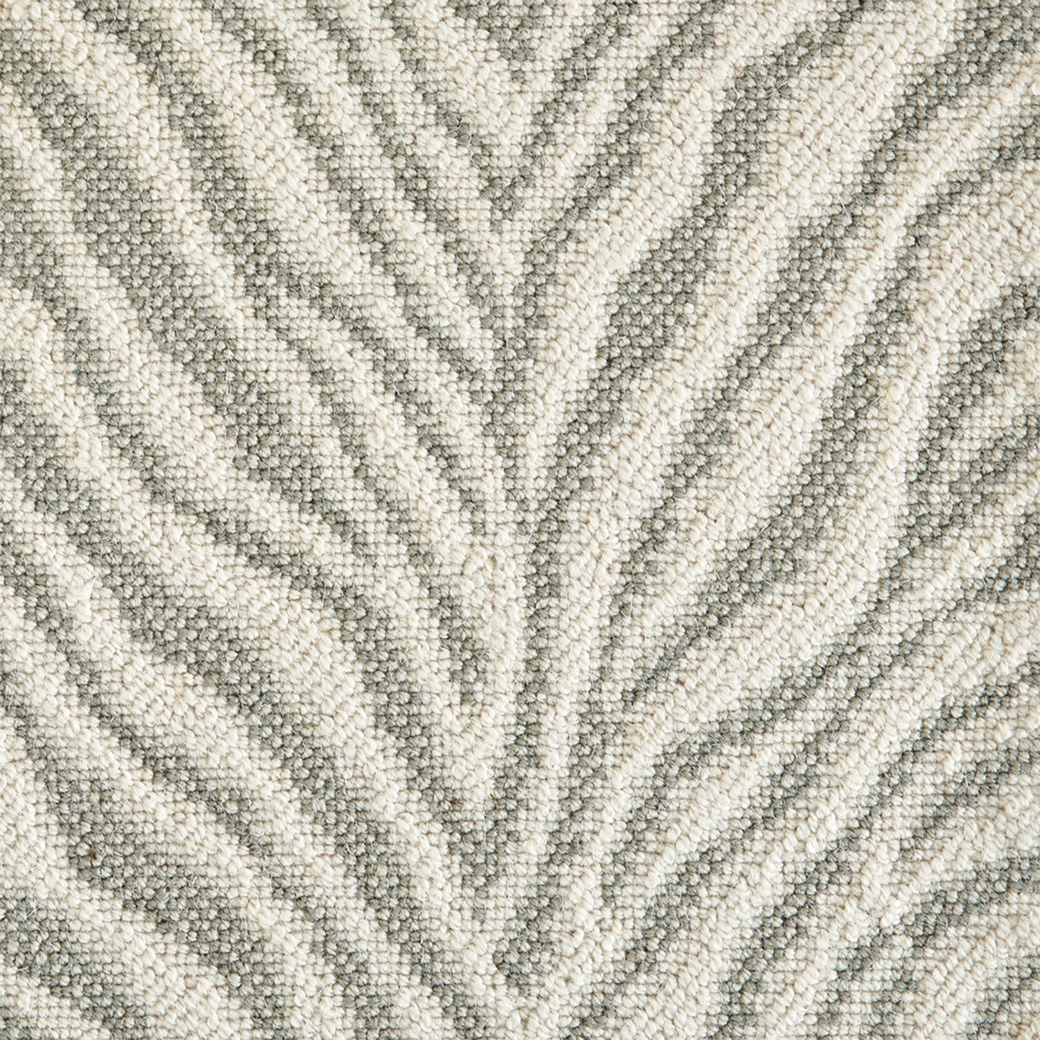 Wool-blend broadloom carpet swatch in an animal print in shades of cream, tan and sage.