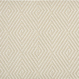Outdoor broadloom carpet swatch in a dense repeating diamond pattern in white on a cream field.