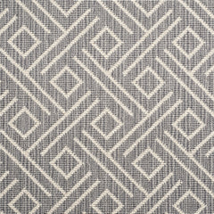Wool-blend broadloom carpet swatch in a geometric line and square pattern in cream on a charcoal field.