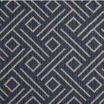 Wool-blend broadloom carpet swatch in a geometric line and square pattern in tan on a navy field.