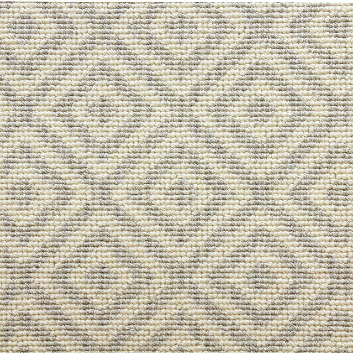 Wool-blend broadloom carpet swatch in a repeating diamond print in light gray on a cream field.