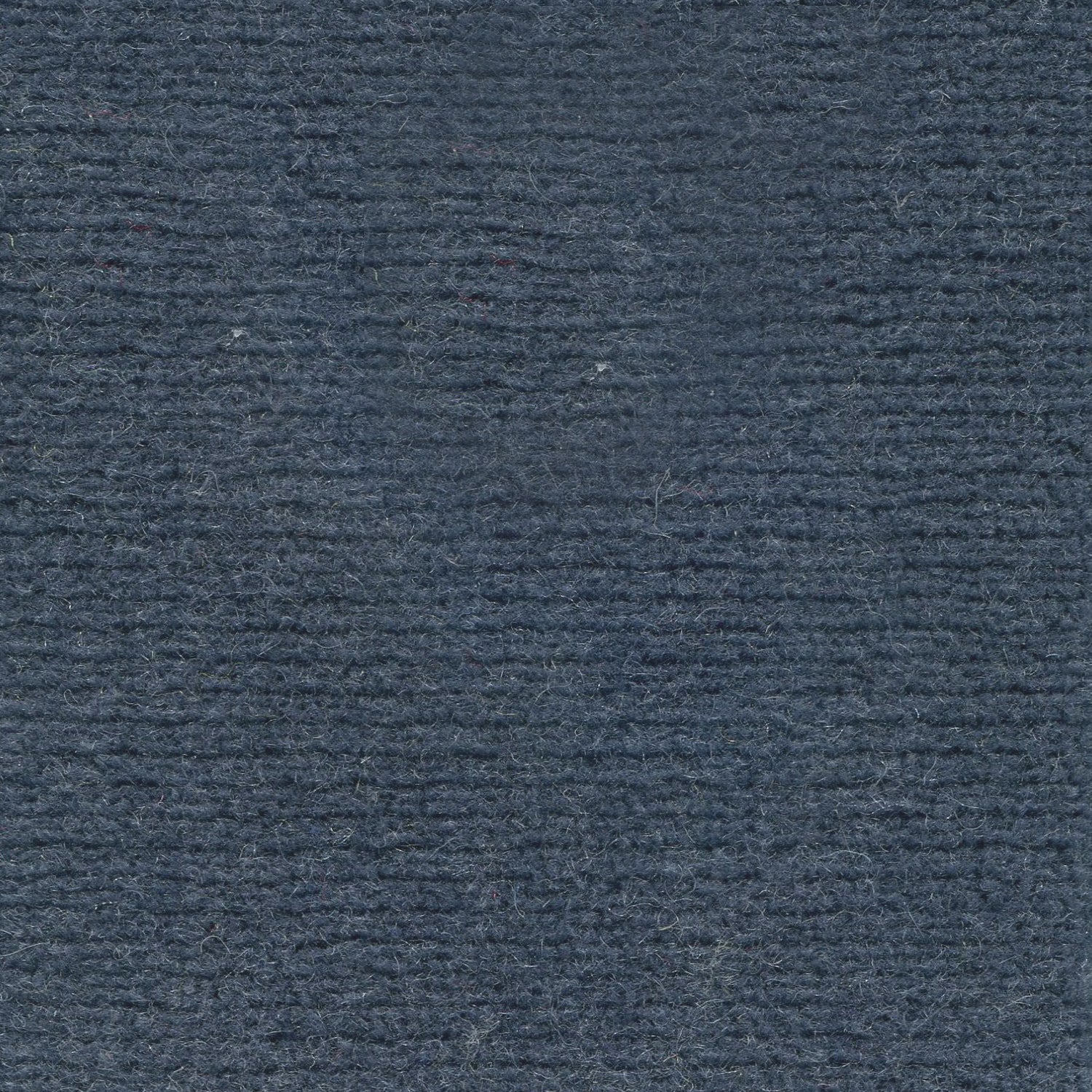 Wool broadloom carpet swatch in a high-pile weave in a solid navy colorway.