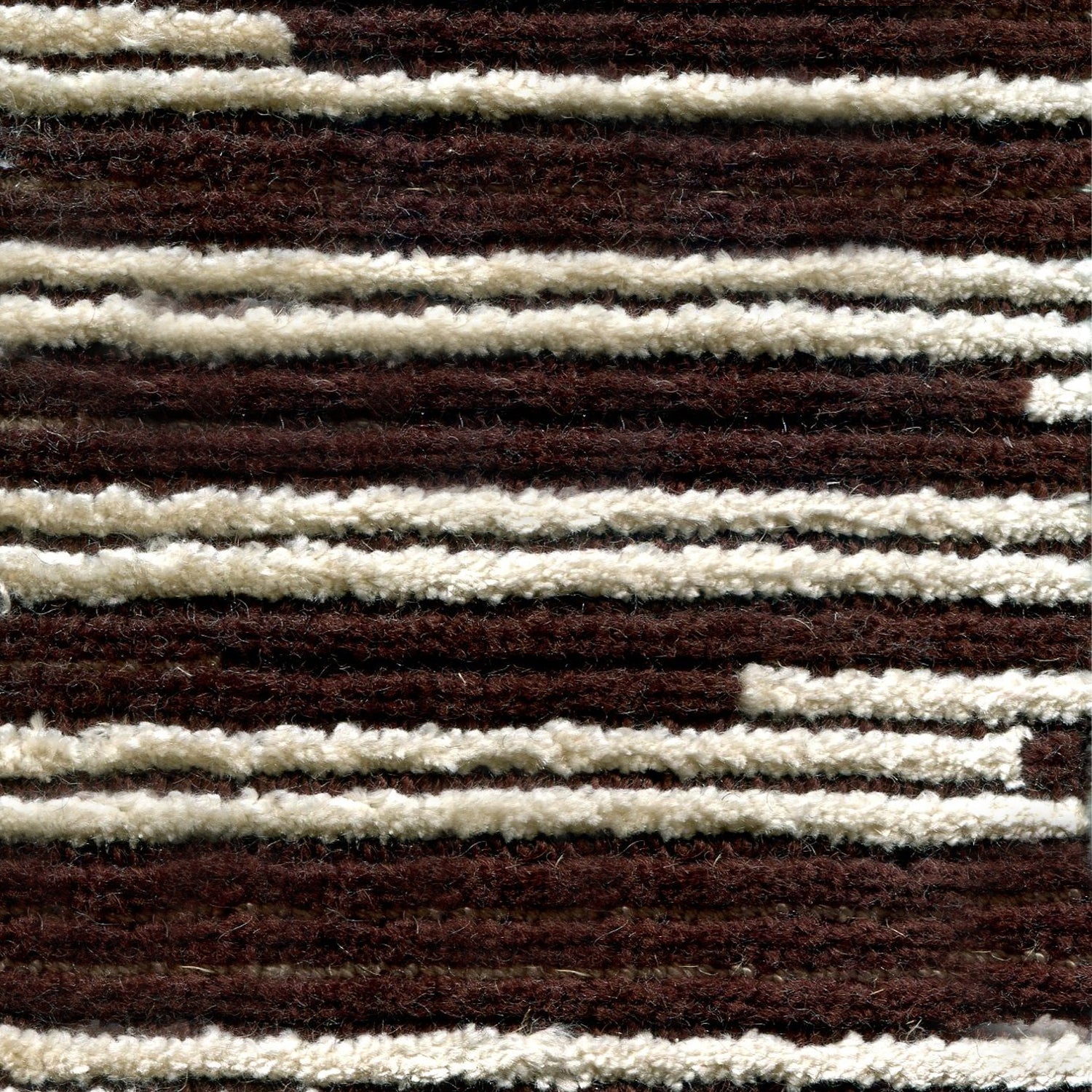 Wool-silk broadloom carpet swatch in a dimensional broken stripe pattern in cream and brown.