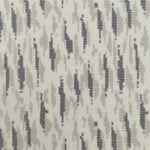 Wool-blend broadloom carpet swatch in a repeating abstract print in tan and charcoal on a cream field.