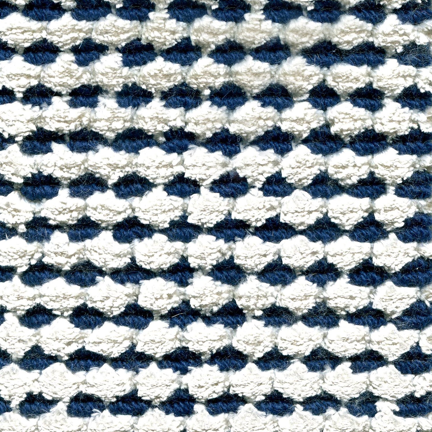 Wool-silk broadloom carpet swatch in a dimensional flat-and-tufted grid weave in white and navy.
