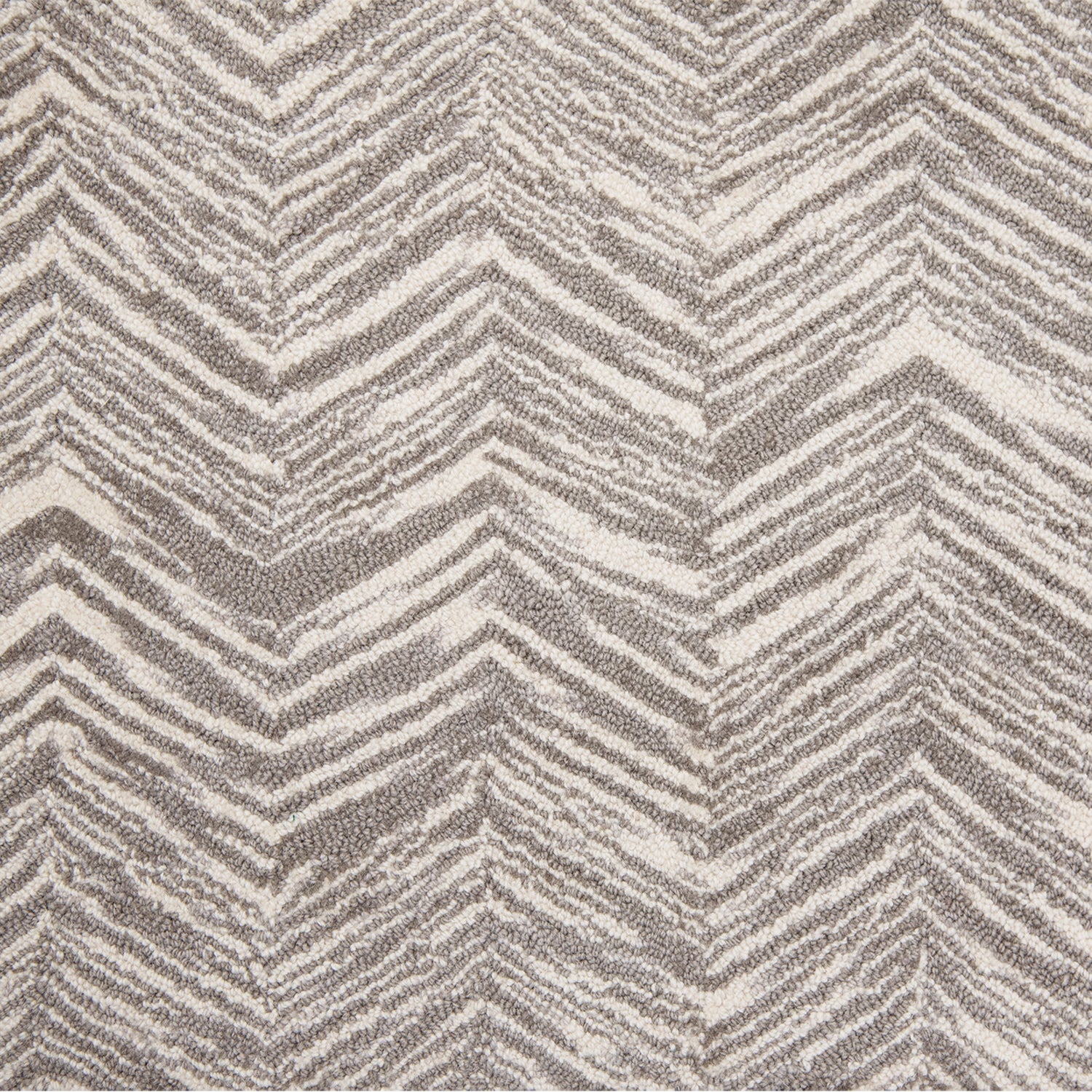 Wool broadloom carpet swatch in a painterly herringbone print in sable on a cream field.